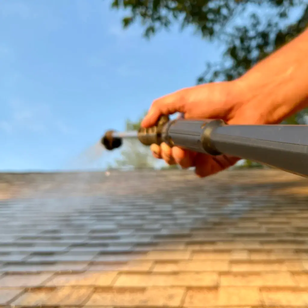 Protective roof coating spray, renewing and extending roof lifespan.