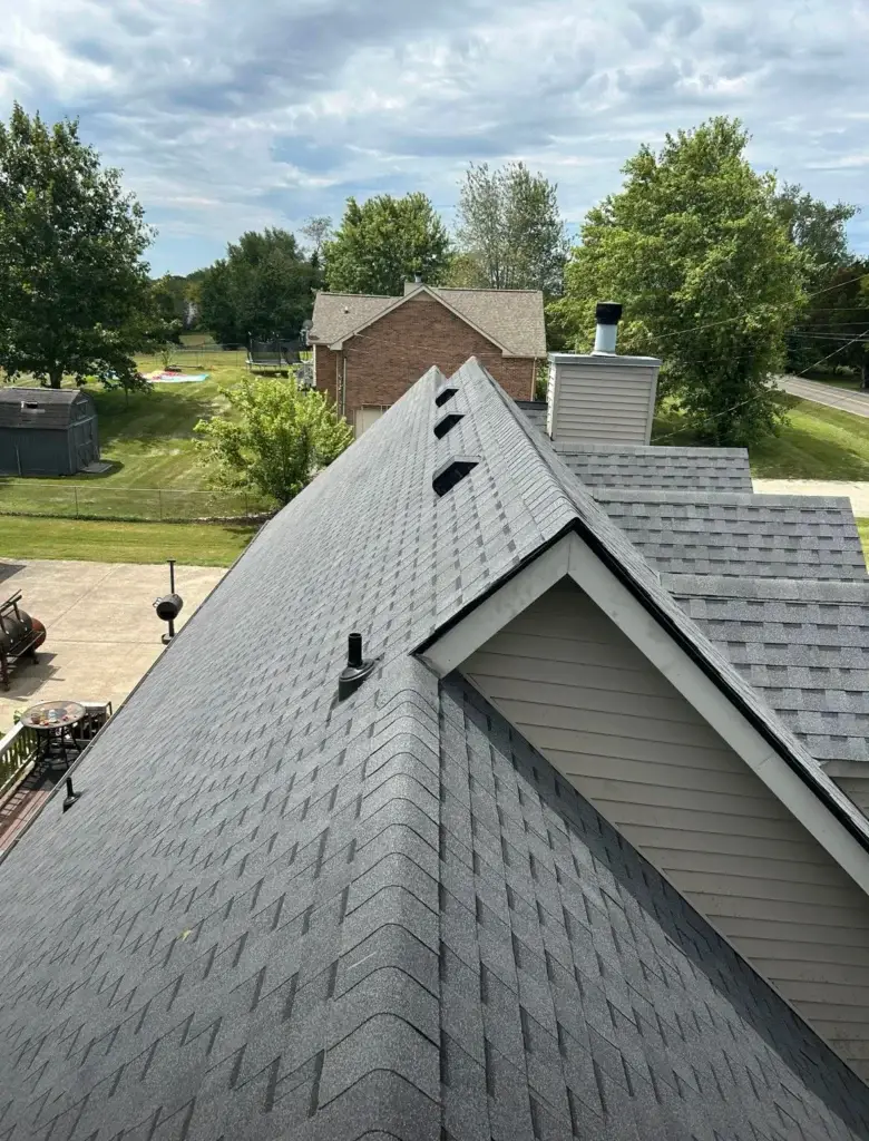 Newly laid grey roofing shingles, showcasing impeccable craftsmanship.